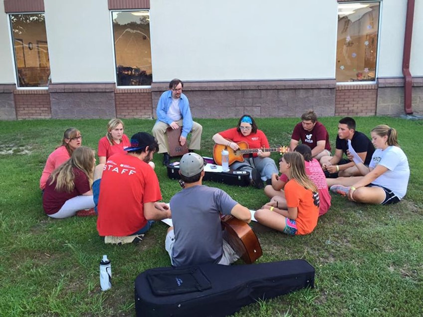 Campers signing worship