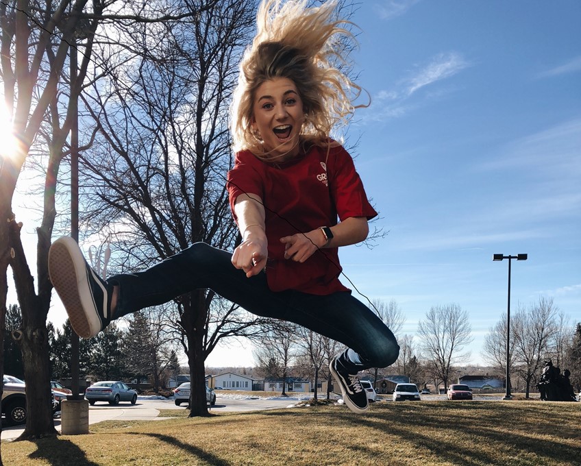 Excited red shirt employee