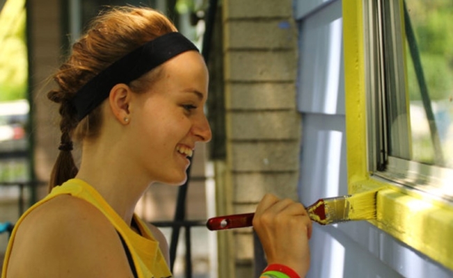 Girl happily painting