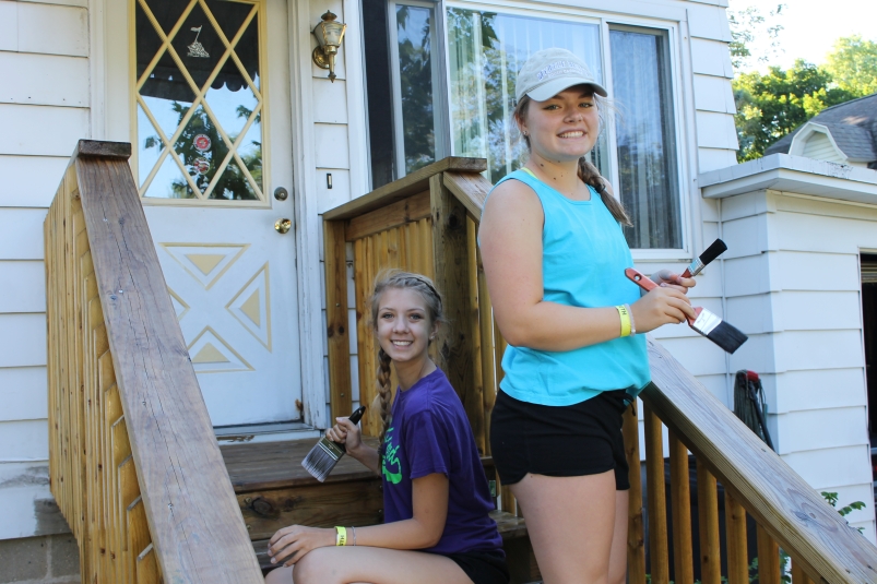 girls working on porch steps