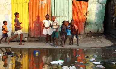 Children in front of flooded street